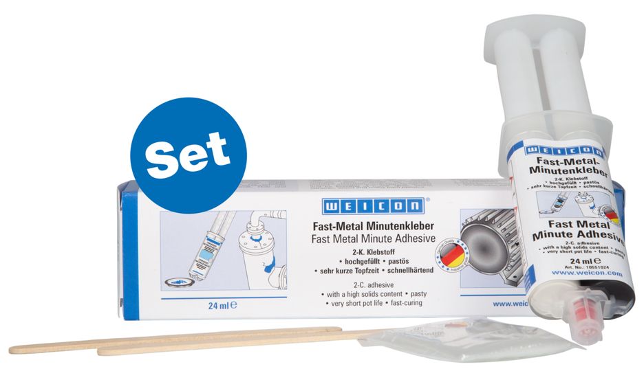 Weicon Fast-Metal Minutenkleber Set mit weißer Box, transparenter Doppelspritze, zwei Holzspateln und Zubehörbeutel. Die Box zeigt Anwendungshinweise und Details zum 2-K-Klebstoff. Blauer Kreis 'Set'.